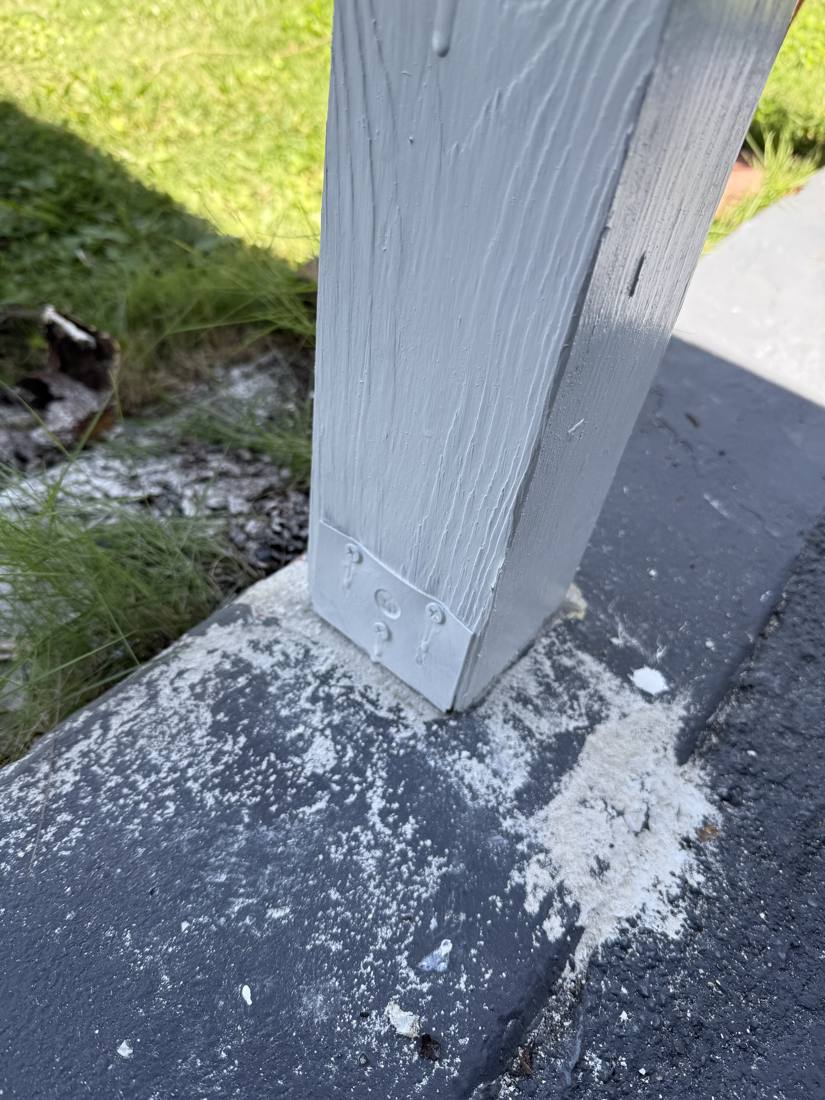 Porch post base repaired and painted